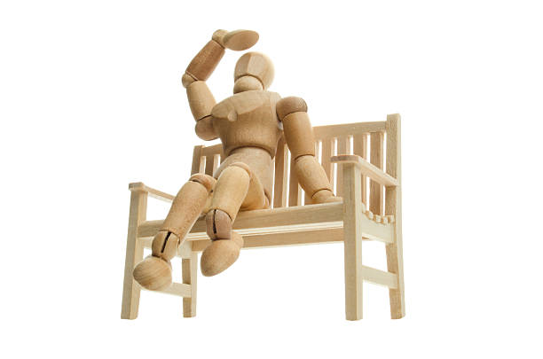man sit on bench wooden dummy emotion
