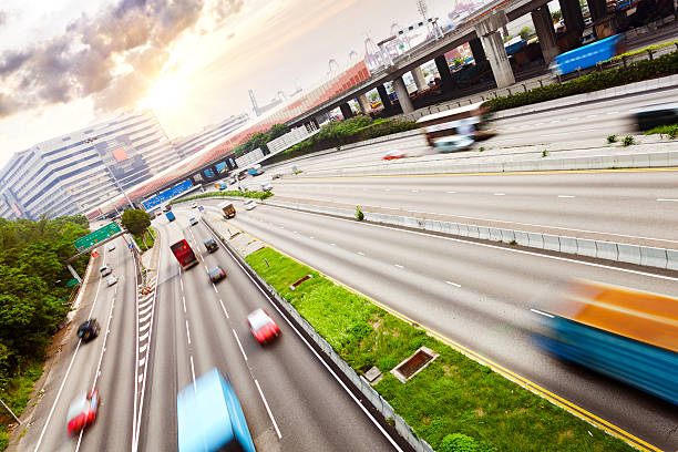 istock busy traffic on multi highway lanes during sunset. 537954003