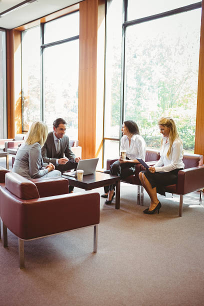 istock Business people talking and working together on sofa 537955241