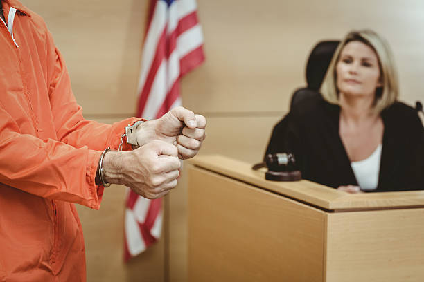 istock Close up of a prisoner wearing handcuffs 537971985