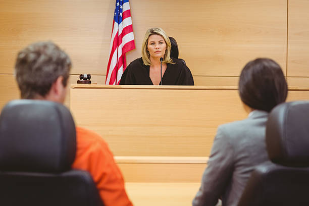 istock Judge and lawyer discussing the sentence for prisoner 537972013