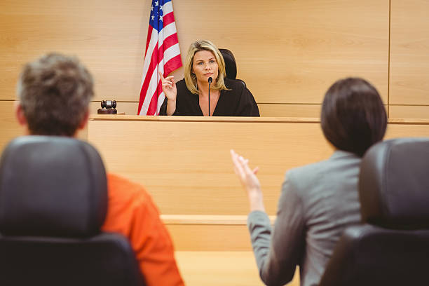 istock Judge and lawyer discussing the sentence for prisoner 537972019