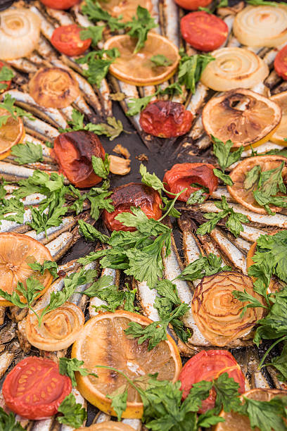 baked anchovy fish on oven pan, detail stock photo