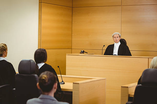 istock Unsmiling judge wearing looking at camera 537975591
