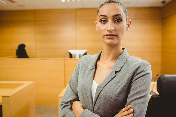 istock Unsmiling lawyer looking at camera crossed arms 537975875