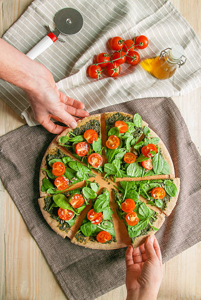 istock Pizza with pesto, spinach and cherry tomatoes 537985567