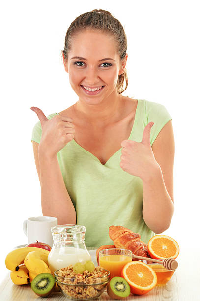 istock Young woman having breakfast. Balanced diet 537985609