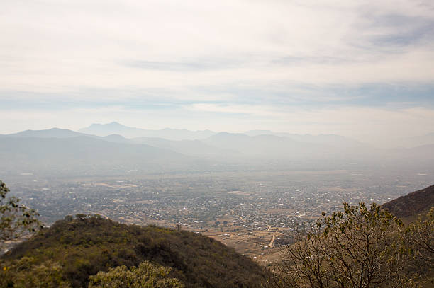 istock Monte Alban hill above Oaxaca valley and cloudy skies 537990281
