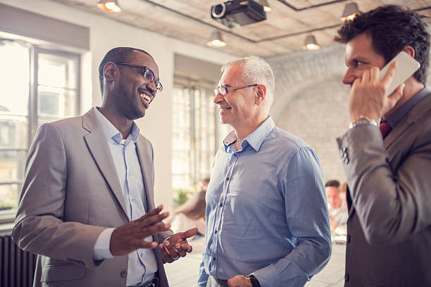 istock Happy businessmen discussing in the office. 537990459