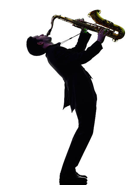 istock man saxophonist playing saxophone player  silhouette 538011185