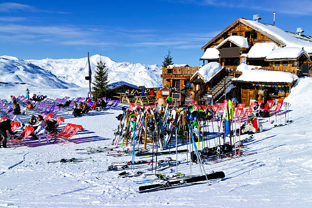 Apres ski in a chalet bar in Alps Val Thorens, Alps, France, February 09 2015: People are relaxing at a chalet bar after skiing and snowboarding in in the 3 Valleys Ski Resort apres ski stock pictures, royalty-free photos & images