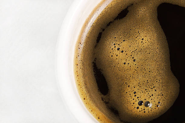 istock Black coffee in a white cup on a white background 538011939