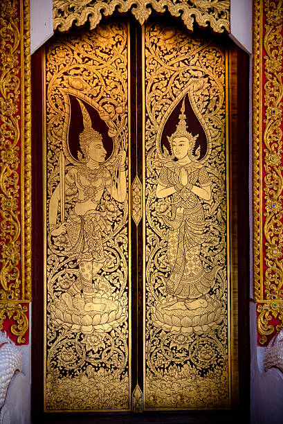 beautiful golden Thai painting on the door in tample beautiful golden Thai painting on the door in tample, chiang-mai, thailand golden tample stock pictures, royalty-free photos & images
