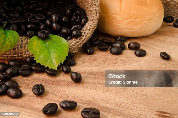 Coffee Bean In Sack On Wooden Table Stock Photo - Download Image Now - 2015, Aromatherapy, Art