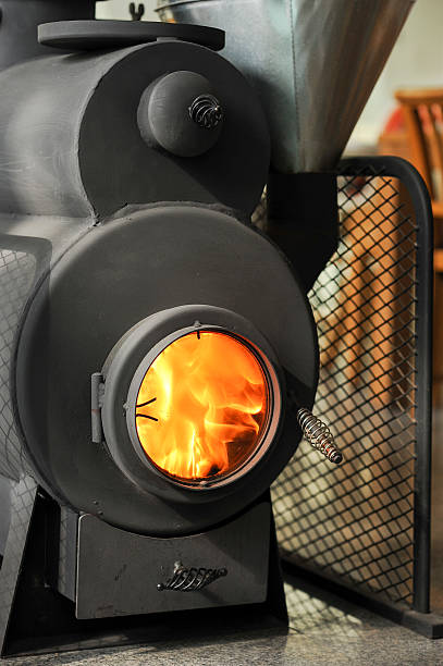 istock Burning Cast Iron Wood Stove Heating 538015899