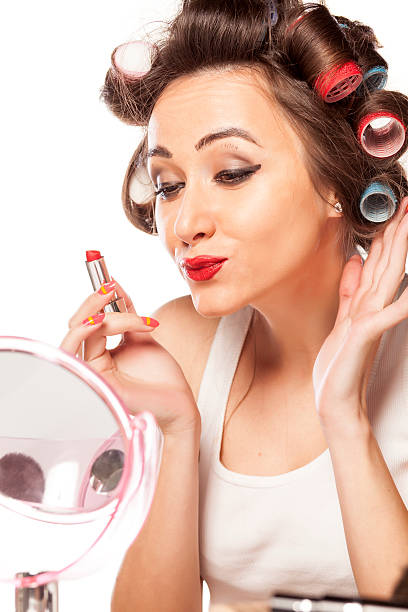istock Satisfied woman with bad makeup looking herself in the mirror 538016039