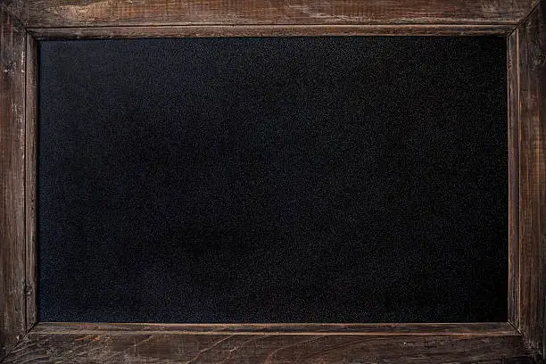 Photo of Background of rustic timber framed clean chalk blackboard copy space