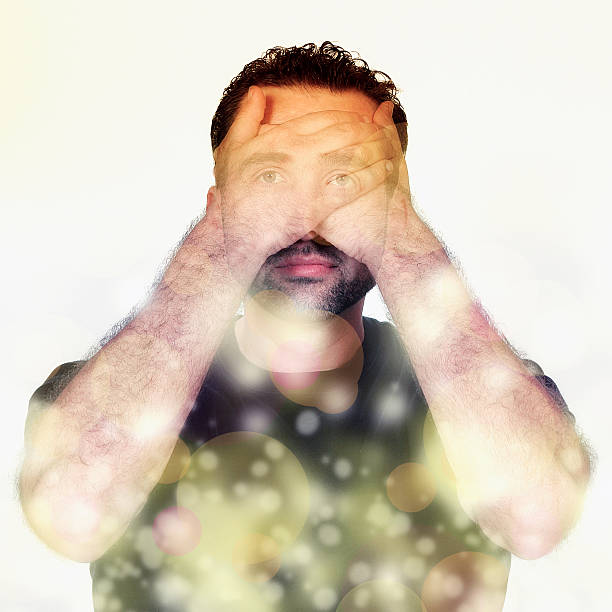istock double exposure of man covering his eyes 538025064