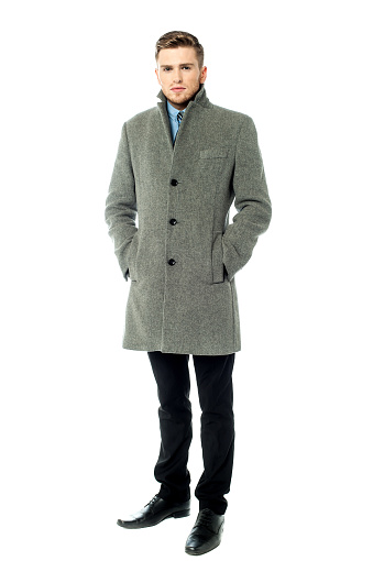 Fashion portrait of handsome young man in overcoat