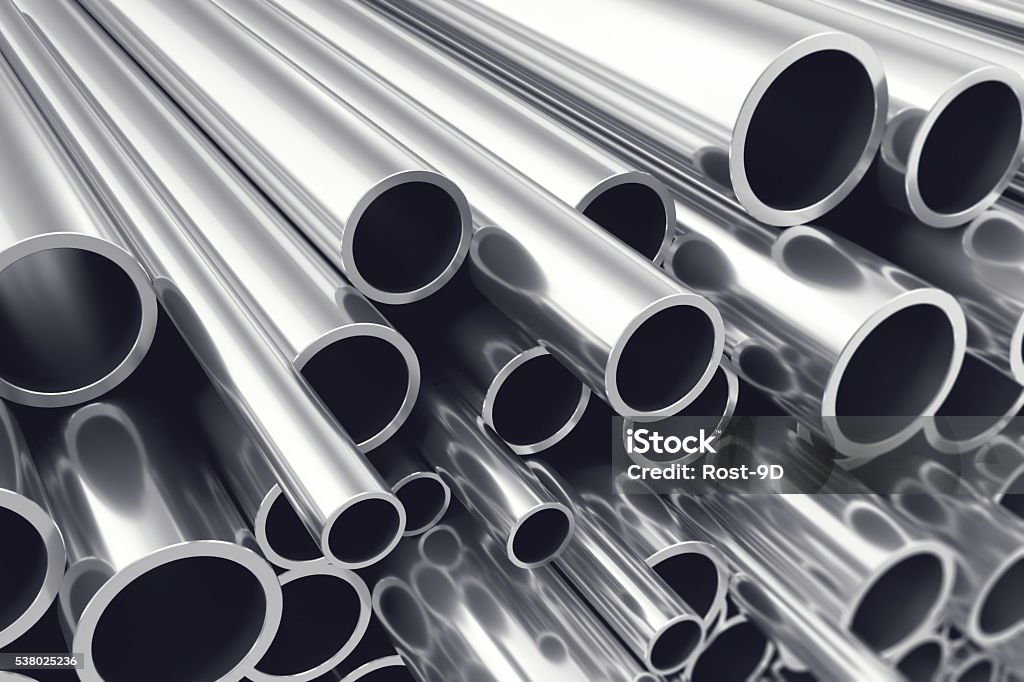 Heap of shiny metal steel pipes with selective focus effect Heap of shiny metal steel pipes with selective focus effect, 3d illustration Steel Stock Photo