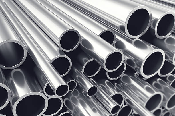 Heap of shiny metal steel pipes with selective focus effect Heap of shiny metal steel pipes with selective focus effect, 3d illustration metal industry stock pictures, royalty-free photos & images