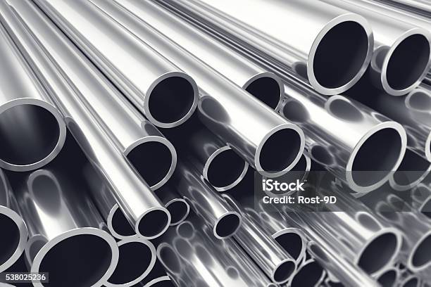 Heap Of Shiny Metal Steel Pipes With Selective Focus Effect Stock Photo - Download Image Now