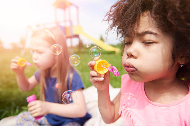 istock Blowing the soap bubble with friends 538025244