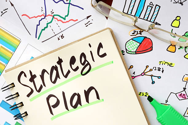 istock Notepad with sign strategic plan on a wooden background. 538025516