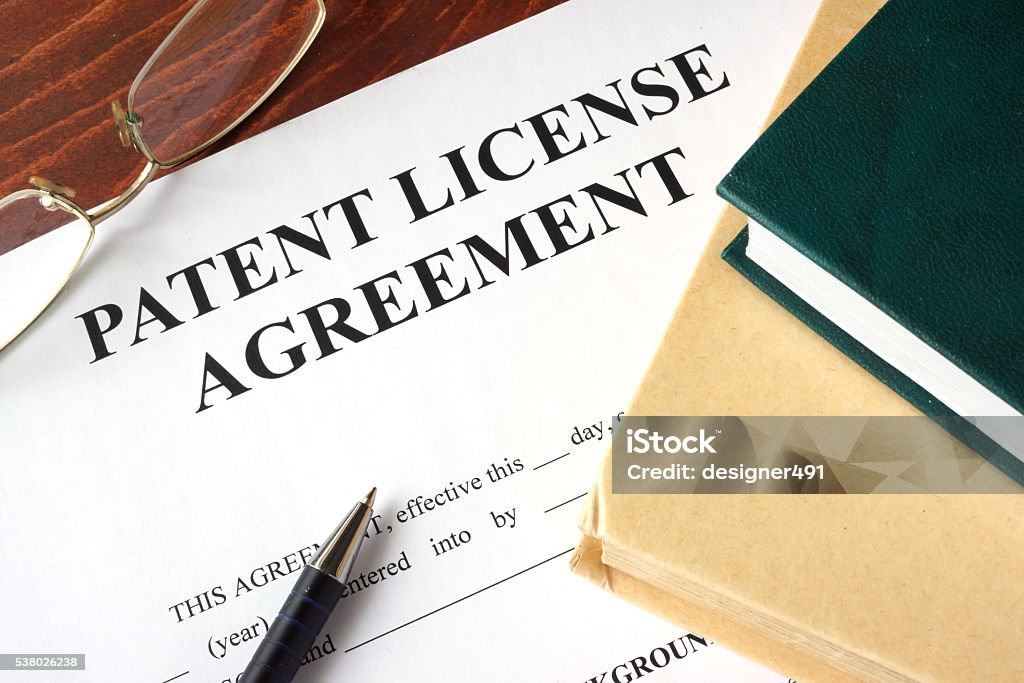 Patent License agreement on a table. Copyright concept. Intellectual Property Stock Photo