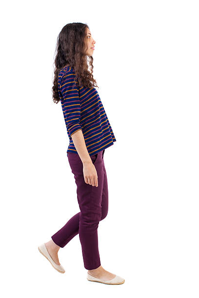 istock side view of walking woman. 538030874