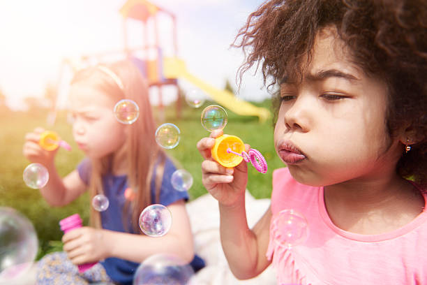 istock Blowing the soap bubble with friends 538034234