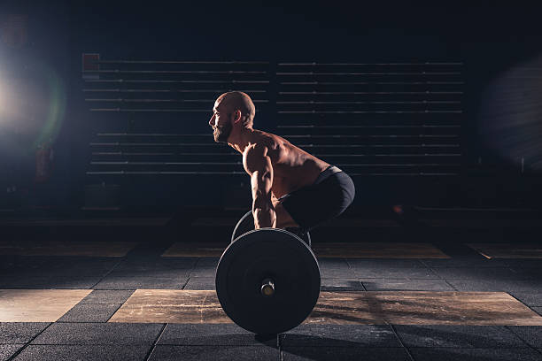 weightlifting strong man on a gym stock photo