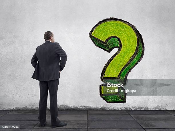 Businessman With Question Mark Painting On The Wall Stock Photo - Download Image Now