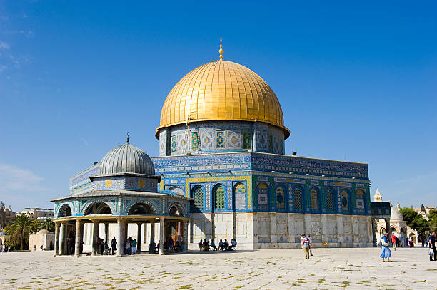 Jerusalem, Israel - 08 October, 2014: Tourists and pilgrims are walking on the Temple Mount in Jerusalem where the Dome of the rock is situated in the center
