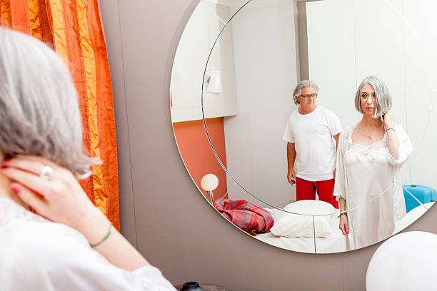 istock mature couple is mirrored before going to sleep 538038796
