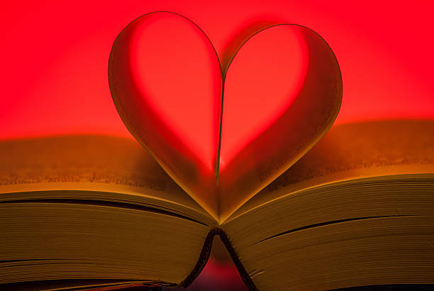 istock pages of a book forming a red heart 538039473