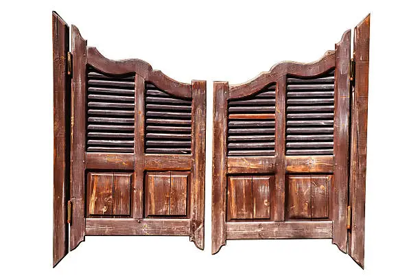 Old rough wooden saloon doors isolated on white with clipping path