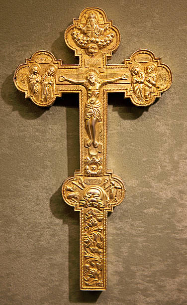 istock golden cross on the wall 538041703