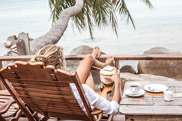 istock Young woman enjoys drinking coffee and coconut 538041746