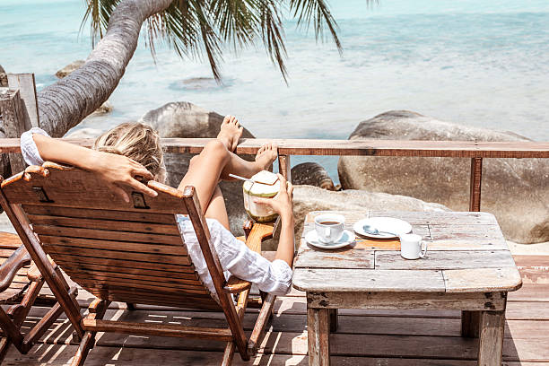 istock Young woman enjoys drinking coffee and coconut 538041832