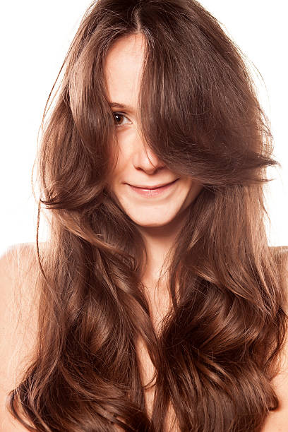 istock Smiling woman with no makeup with hair over half face 538042357