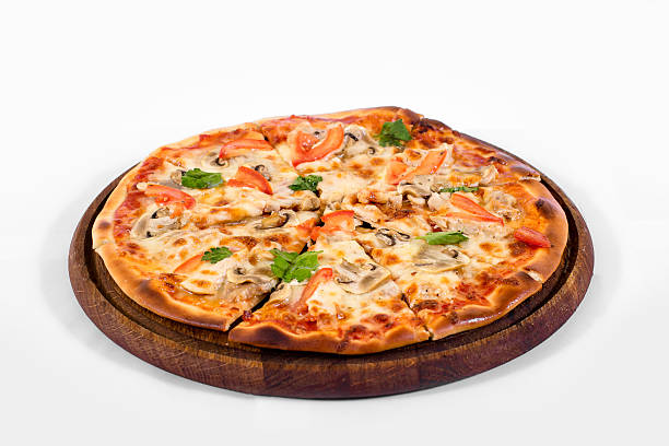 istock Pizza on a wood plate on a white background 538044360