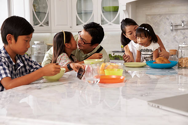 istock Father Leaving For Work After Family Breakfast In Kitchen 538044786