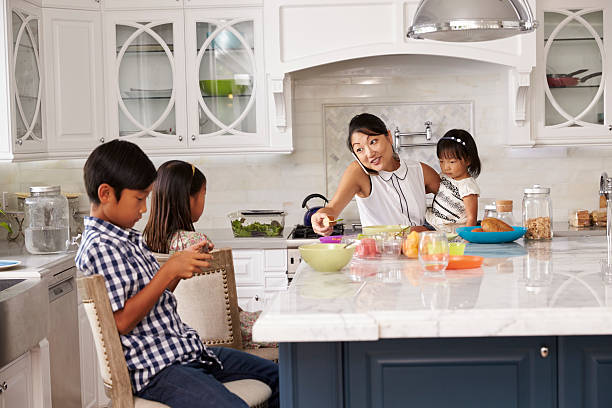 istock Busy Mother Organizing Children At Breakfast In Kitchen 538044936