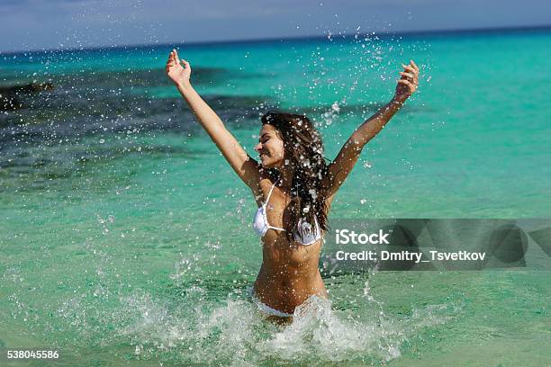 Young Woman Have Fun In Water Stock Photo - Download Image Now - Adult, Arts Culture and Entertainment, Beach