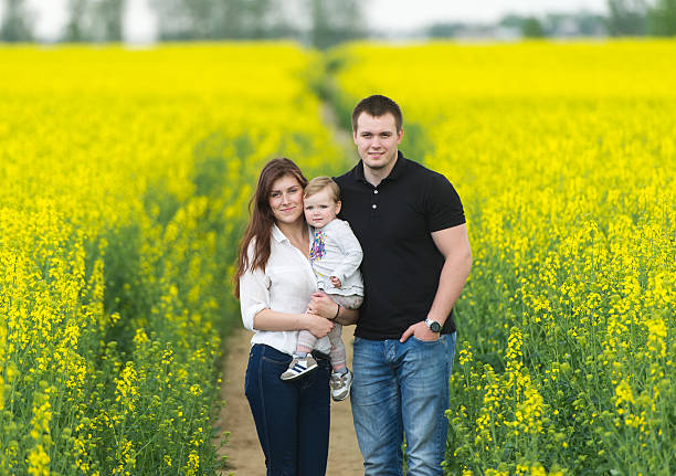 istock Happy family have a rest on the yellow rape field. 538047864
