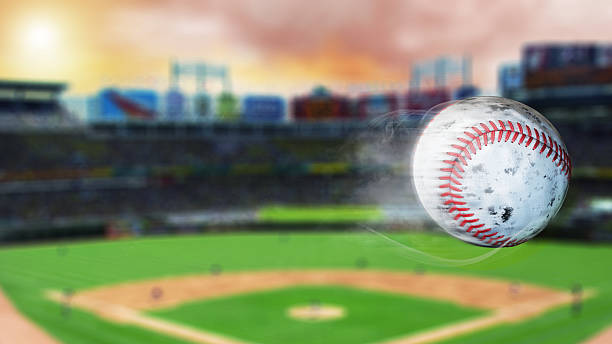 3d illustration of flying baseball leaving a trail of smoke. Spinning dirty baseball, selerctive focus.Leadership concept, One glowing light bulb standing in front of unlit incandescent bulbs with reflection on dark background