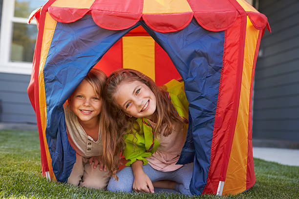 istock Two Children Playing Inside Tent In Garden Together 538048212
