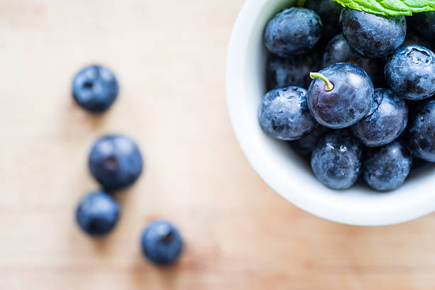 istock Top view of blueberries on a wooden table. 538048726
