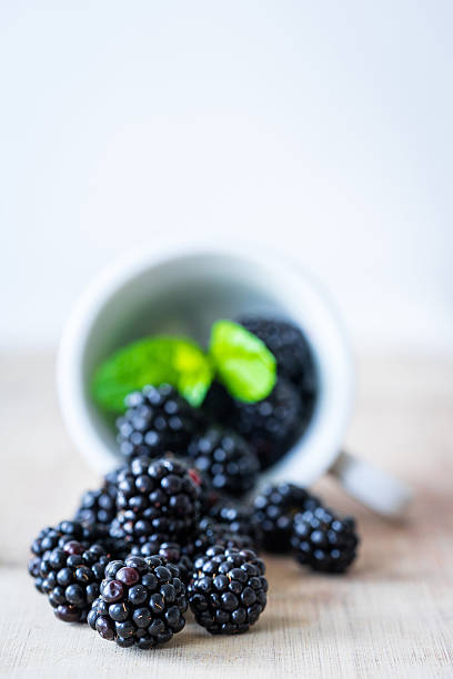 Blackberries on a wooden table. stock photo